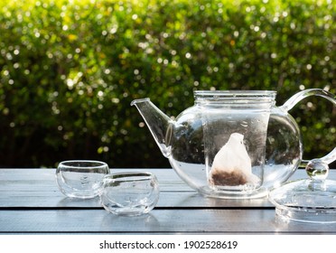 Tea Bag In Glass Kettle Preparing For Making Chinese Tea