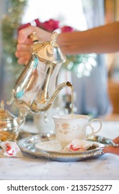 Tea Break In English Style, Female Hands In White Lace Gloves Pour Milk 