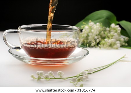 Similar – Cup with acacia blossoms Tea with spoon and honey