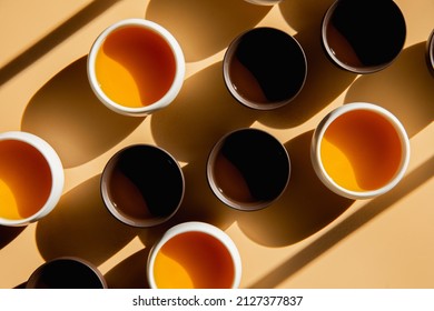 Tea ceremony set. White and brown tea cups. Green herbal and black tea. Horizontal image - Powered by Shutterstock