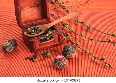 Tea Chest With Dry Lotus Flowers On An Orange Background