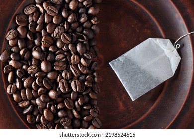 Tea Or Coffee Beans And A Tea Bag. Coffee Vs. Tea. Choice Of Drink Concept Top View