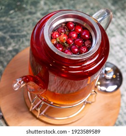 Tea With Cranberries And Spices In A Glass Teapot. A Healthy Diet Rich In Vitamins And Antioxidants. Life Style.