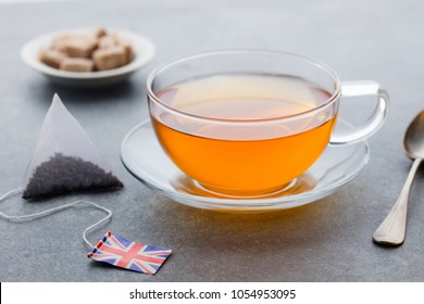 Tea Cup With British Flag Tea Bag Label. Grey Background. Close Up.