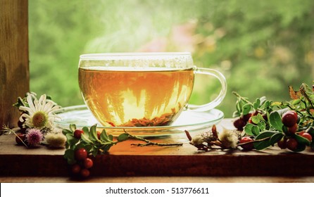 Tea Cup With Tea Leaves On Window.  Summer Tea Time.