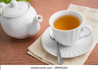 Tea Cup And Tea Pot On Table