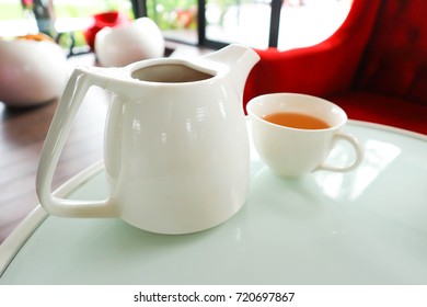tea cup and tea pot on the table