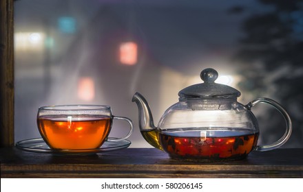 Tea Cup With Tea Pot On Window. Winter Tea Time.