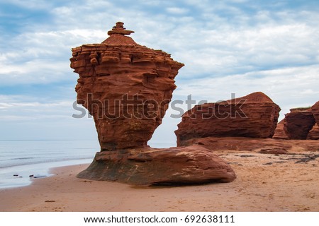The Tea cup or pot a Red sandstone rock formation, sea stack, on a north shore beach in Darnley area of Prince Edward Island Canada, waves erode the lower rock leaving a free standing structure