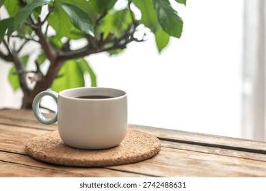 Tea cup with side light and space for text. Cozy minimal mood.