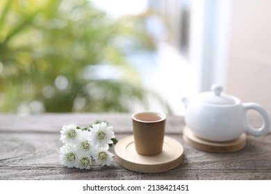 Tea Cup And White Tea Pot With White Chrysanthemum Vase