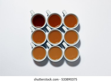 Tea Of Different Strengths In White Espresso Cups