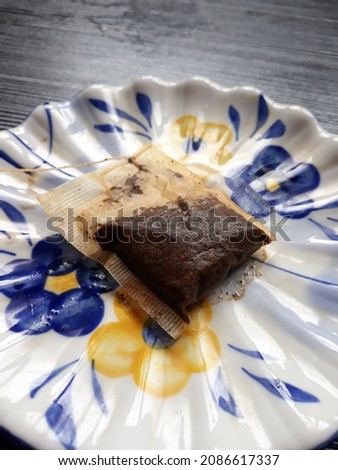 a tea dregs on a floral plate