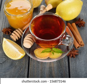 Tea with ginger on a gray table