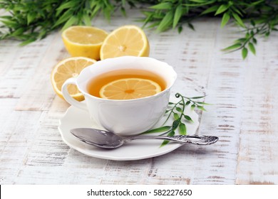 Tea. Herbal tea. Mint leaf. Tea in a glass cup, mint leaves, dried tea, sliced lime. herbs on a slate plate in a restaurant or teahouse