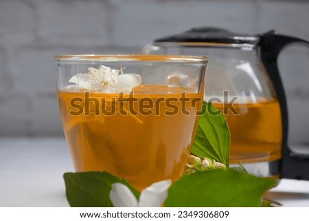 Similar – Cup with acacia blossoms Tea with spoon and honey