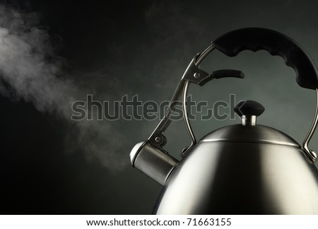 Tea kettle with boiling water