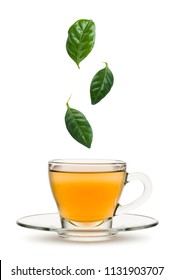 Tea Leaves Falling Into Tea Cup, On White Background