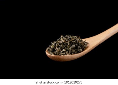 
Tea Leaves On A Wooden Spoon
