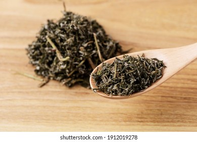 
Tea Leaves On A Wooden Spoon
