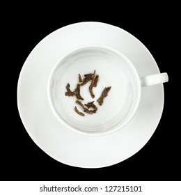 Tea Leaves In A White Cup On A Black Background