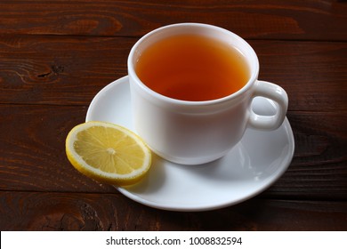 Tea with lemon and oatmeal cookies on a wooden background - Powered by Shutterstock