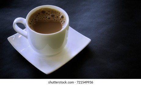 Tea With Milk Or Popularly Known As Teh Tarik,  Very Famous In Malaysia On An Isolated Black Background. 