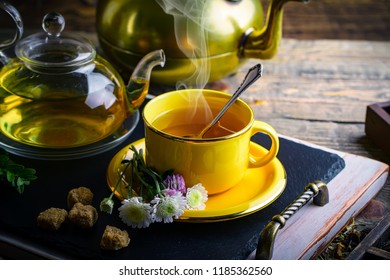 Tea on an old background, in a composition with accessories on the table