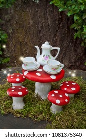 Tea party with fairies in forest with sparks of light