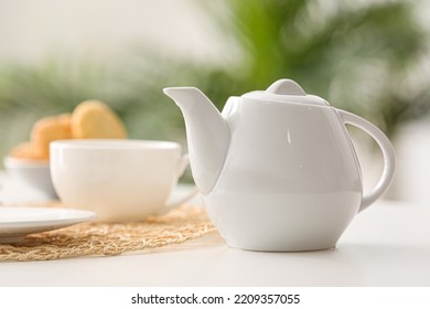 Tea pot on table in cafe