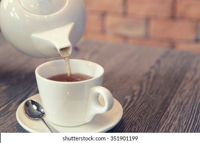 Tea Pouring Into Glass 