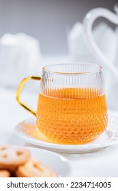 Tea served in glass mug in a bright scene. Morning tea breakfast.