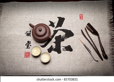 Tea set on chinese calligraphy of tea