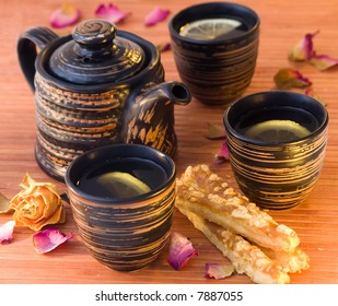 Tea with slice of lemon and  cookie