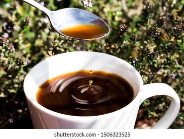 Tea Spoon Drop Coffee In A Cup.top View Sunlight And Shadow