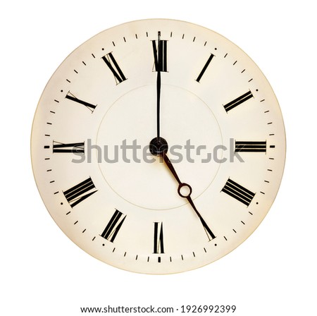 Tea Time concept. Antique clock face pointing at fiveo'clock isolated against white background. 