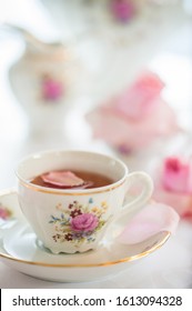 Tea Time Served With  Fine China Porcelain Set With Floral Pattern.