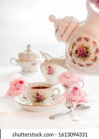 Tea Time Served With  Fine China Porcelain Set With Floral Pattern.