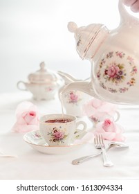 Tea Time Served With  Fine China Porcelain Set With Floral Pattern.