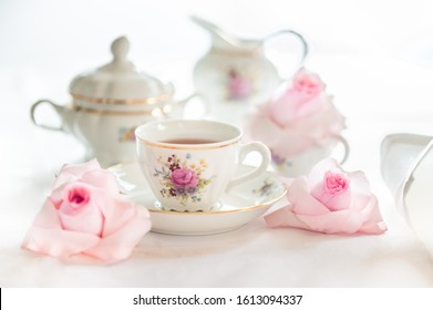 Tea Time Served With  Fine China Porcelain Set With Floral Pattern.