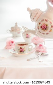 Tea Time Served With  Fine China Porcelain Set With Floral Pattern.