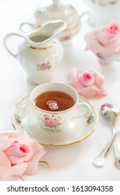 Tea Time Served With  Fine China Porcelain Set With Floral Pattern.