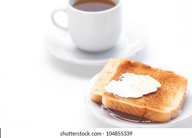 Tea And Toast With Butter Isolated On White