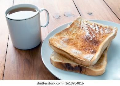 Tea And Toast On A Rustic Wooden Table