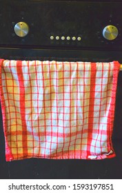 Tea Towel Drapped Over The Oven Door