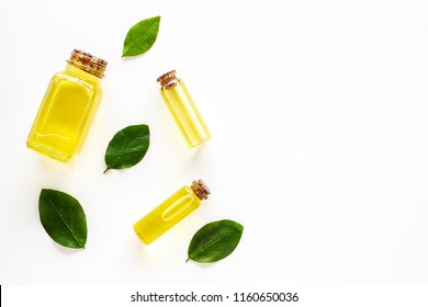 Tea Tree Essential Oil Near Tea Tree Leaves On White Background Top View Copy Space