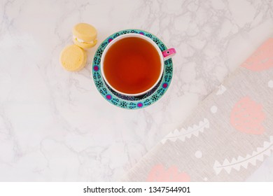 Tea In Vintage Cup On Marble Counter With Melting Moments And Tea Towel, Flat Lay Top View