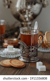 Tea. Tea in a vintage glass on the background of a samovar. 
 