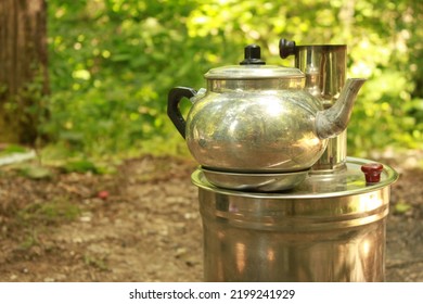 tea and wood fire in samovar. Turkish culture. brewing tea. picnic in nature - Shutterstock ID 2199241929