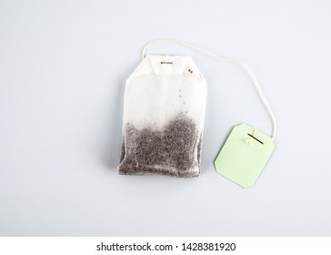 Teabag With Green Label. Top View, On A White Background. Mockup